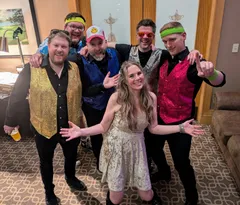 Wedding guests in sequined vests